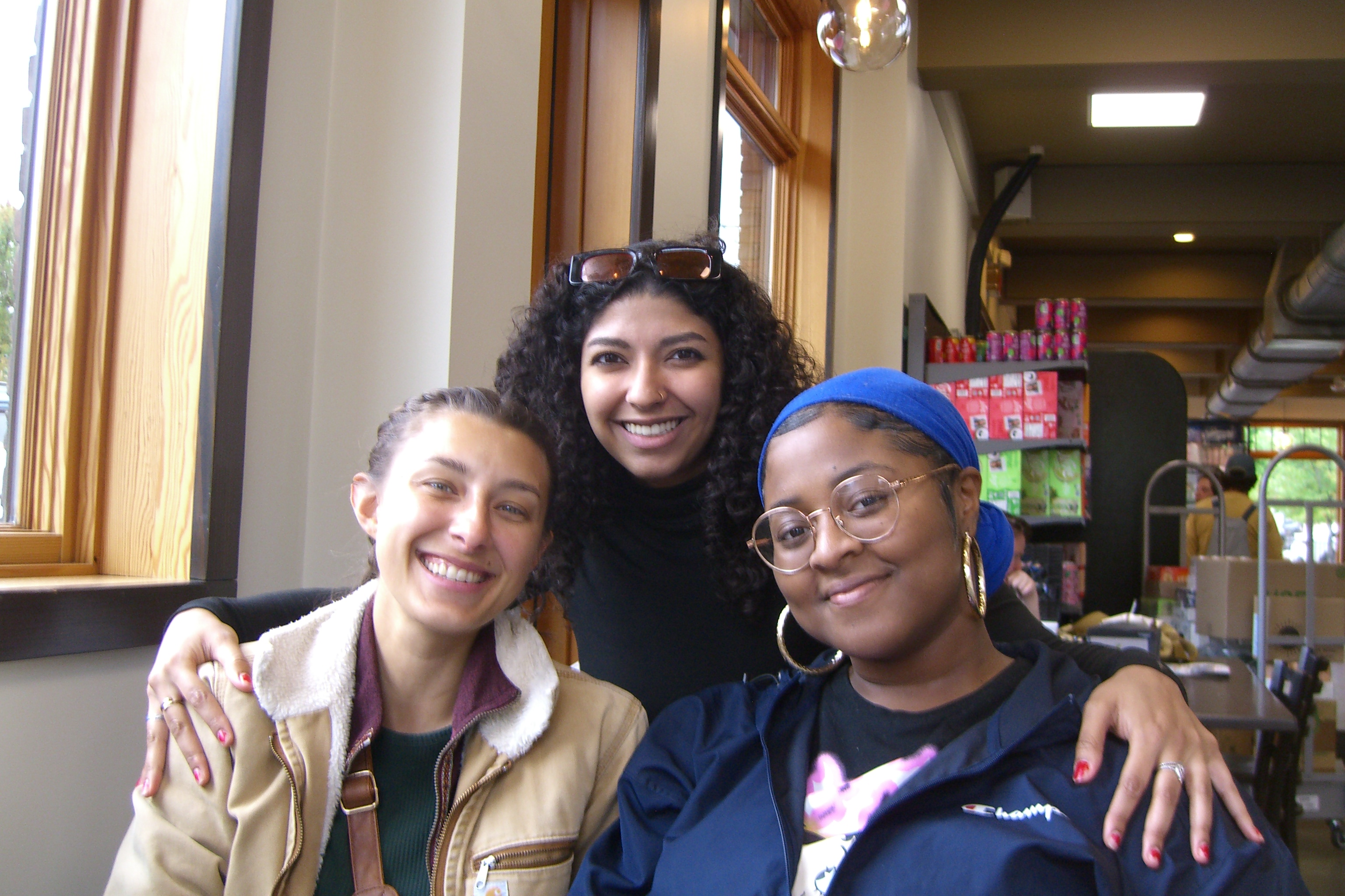 Three friends at a cafe