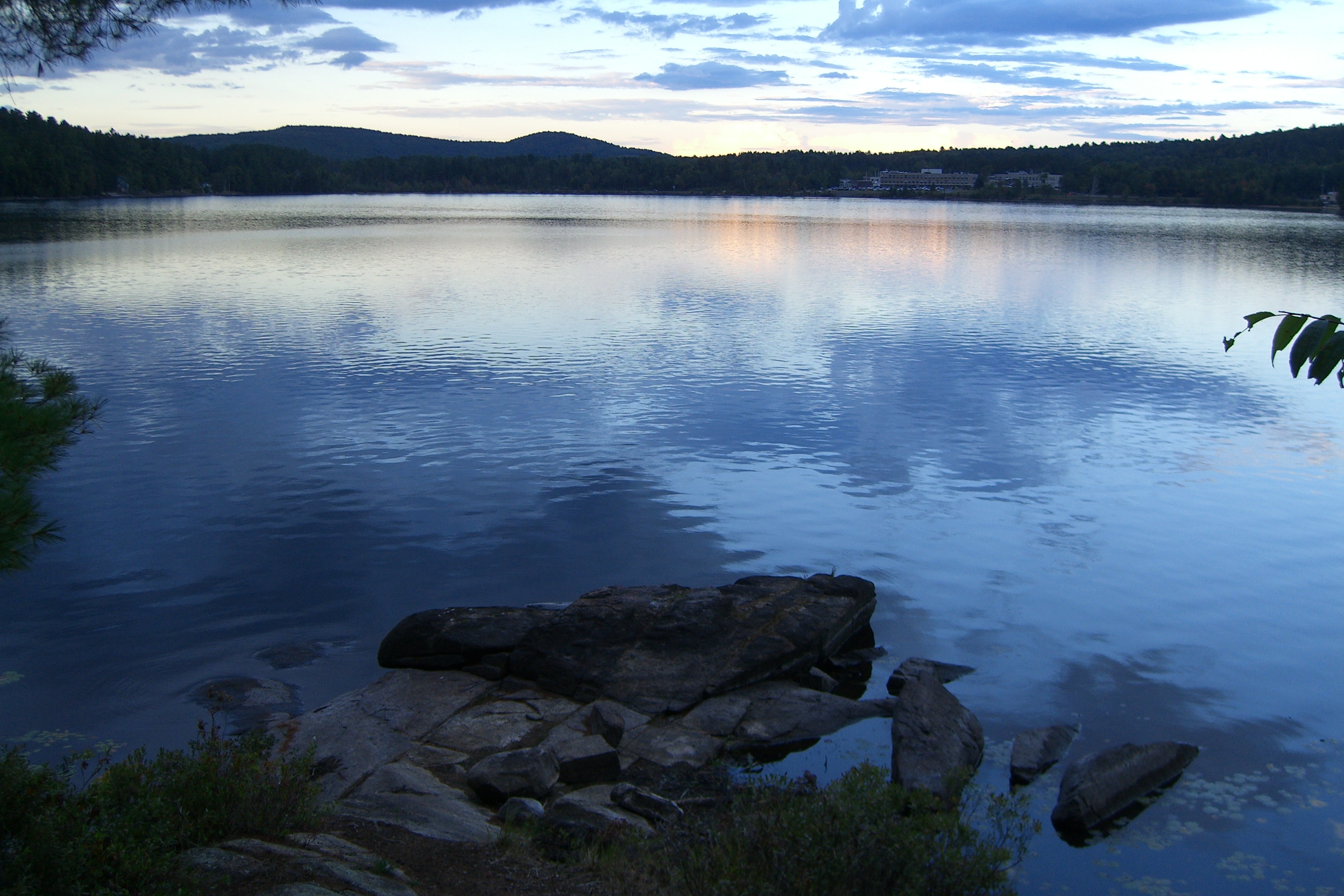 Lake at dusk with mountains