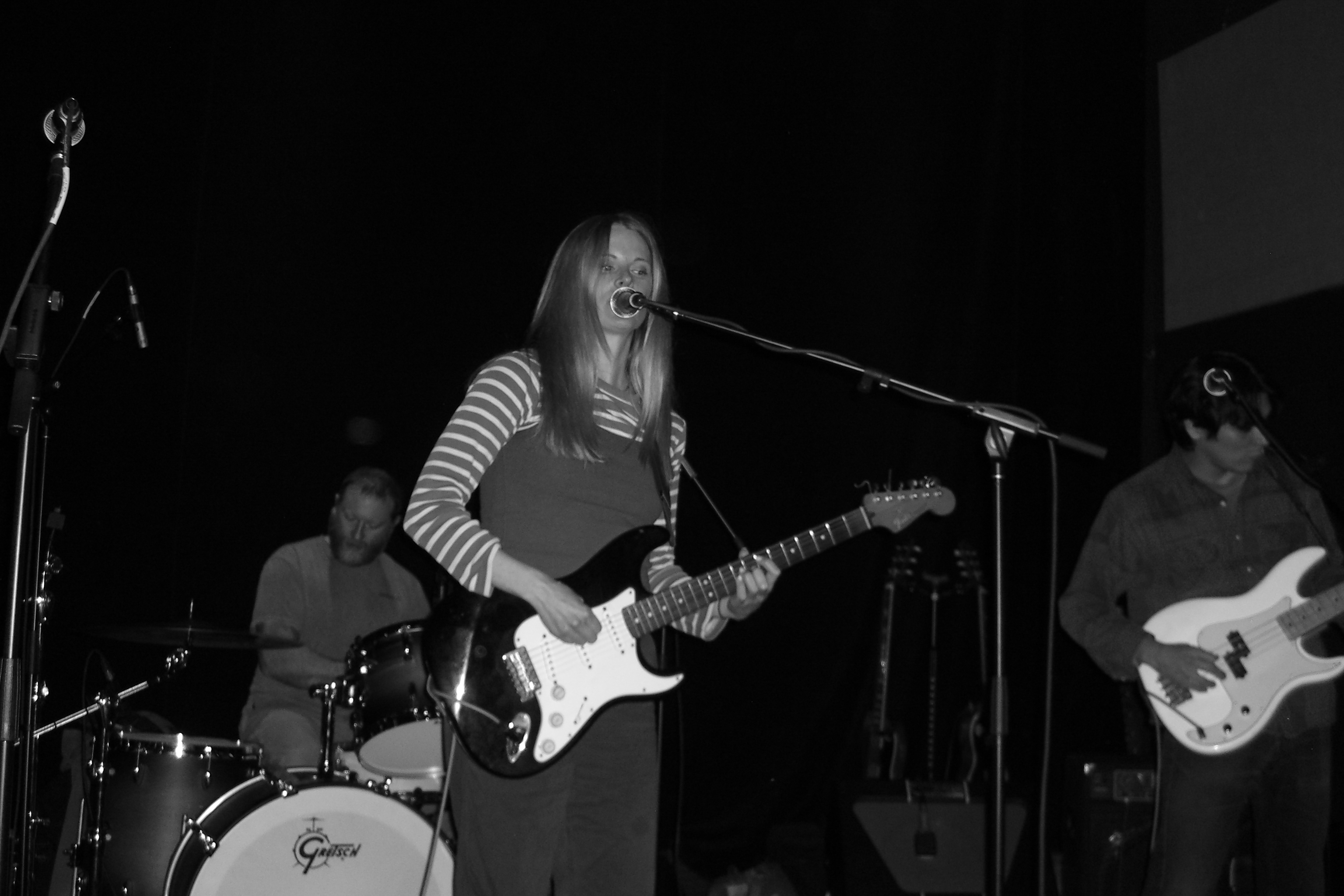 Singer performing with full band on stage